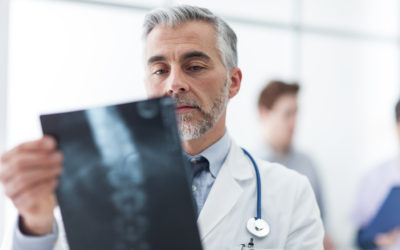 Radiologist examining a patient’s x-ray